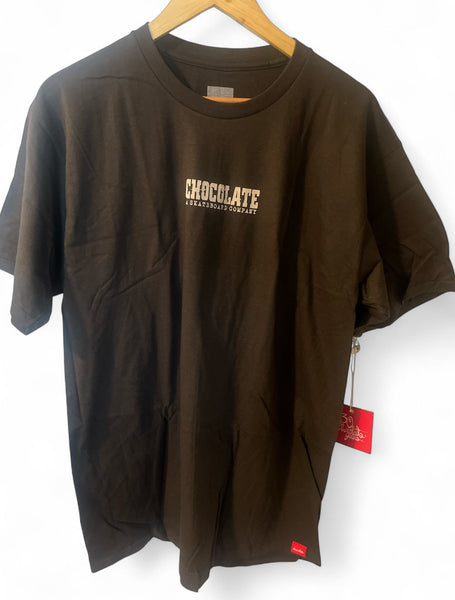 Brown large CHOCOLATE SKATEBOARDS Western short sleeve t-shirt hanging on wooden hanger