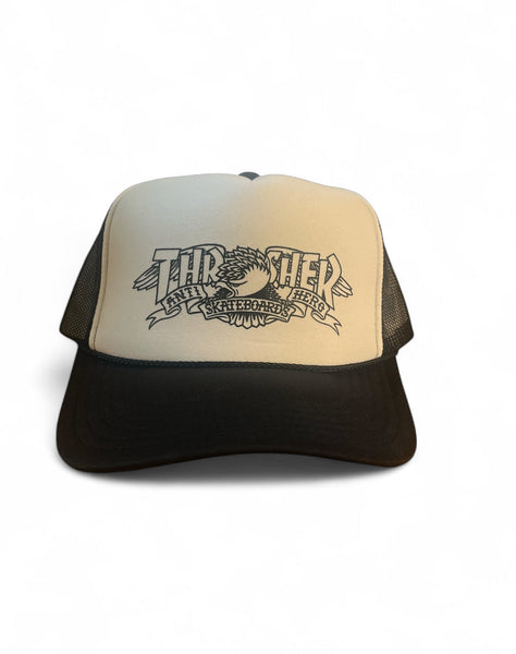 Black and white THRASHER/ANTI HERO Mag Banner trucker hat with mesh back and skateboarding logos