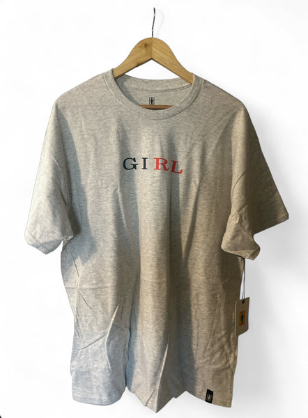 Ash gray short sleeve t-shirt with GIRL letterpress design hanging on wooden hanger